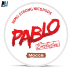 Close‑up of Pablo Exclusive Mocca 50mg nicotine pouch held between fingertips, showing its slim format, all‑white tobacco‑free composition, and bold mocha label